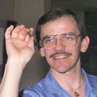 Photo of Bob Sinaeve preparing to throw a dart